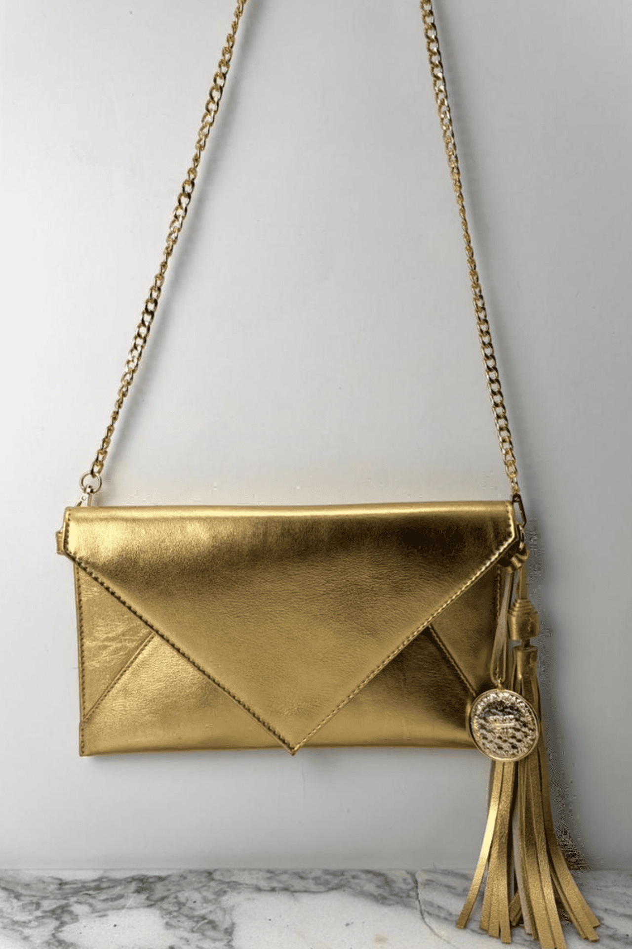 Icon Clutch - Oro
